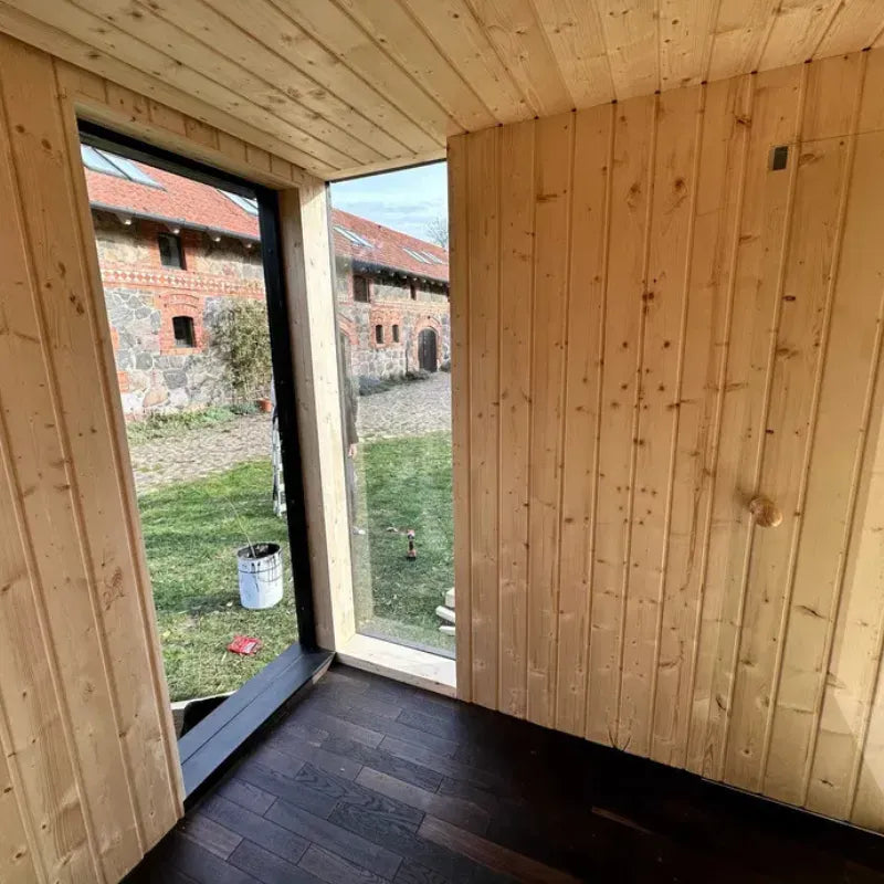 Sauna extérieur Tobus 475 cm – avec vestiaire et baie panoramique